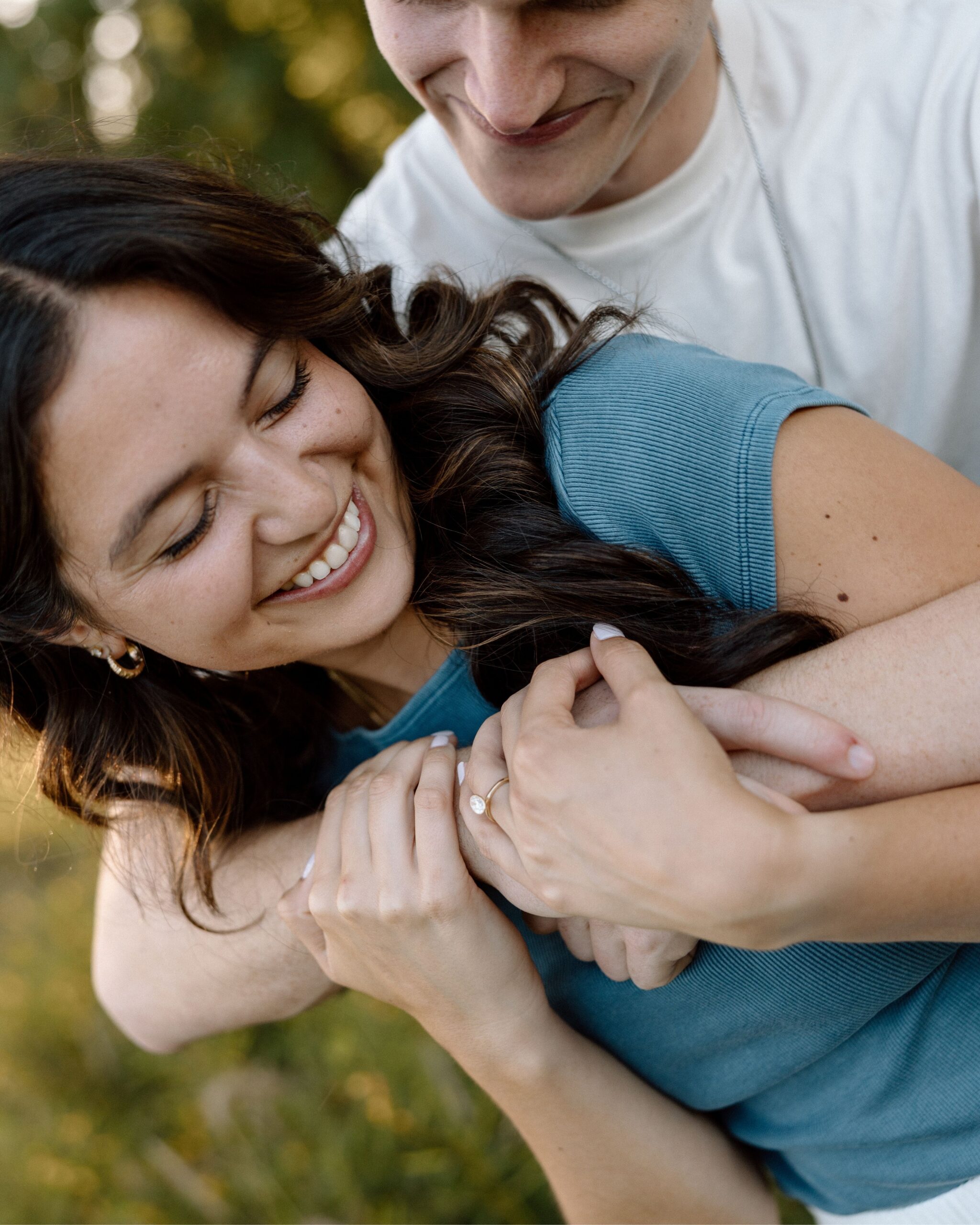 engagement couple, hugging and laughing